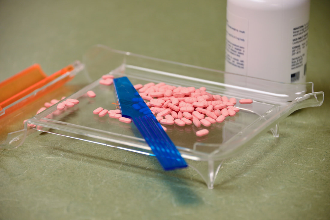 Pet medication in a clear tray